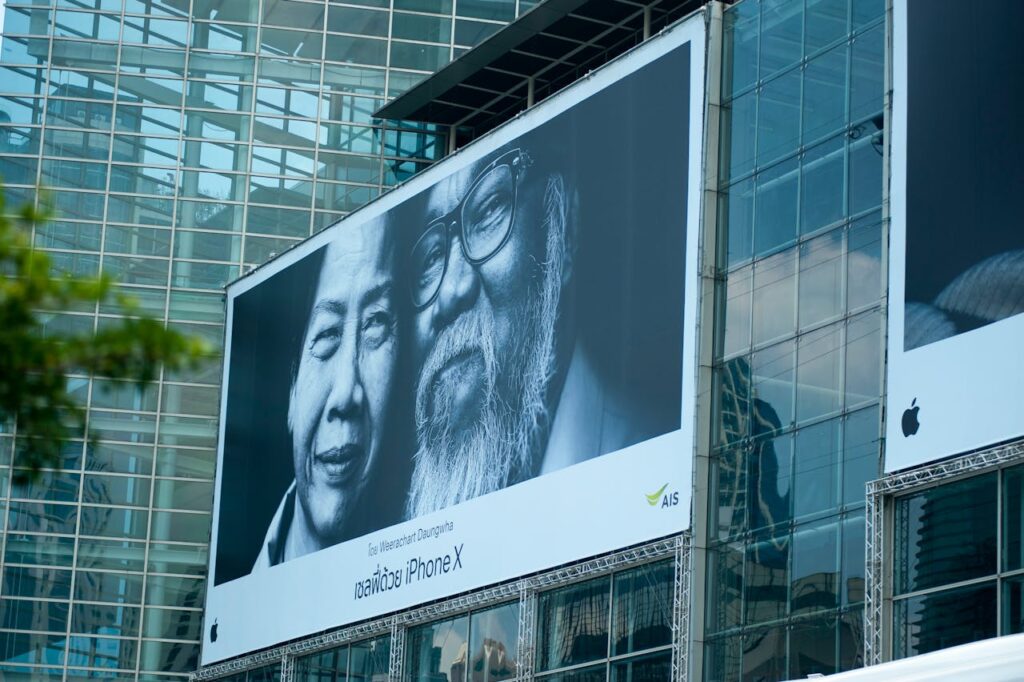 Futuristic urban scene featuring a large billboard on a glass skyscraper facade.